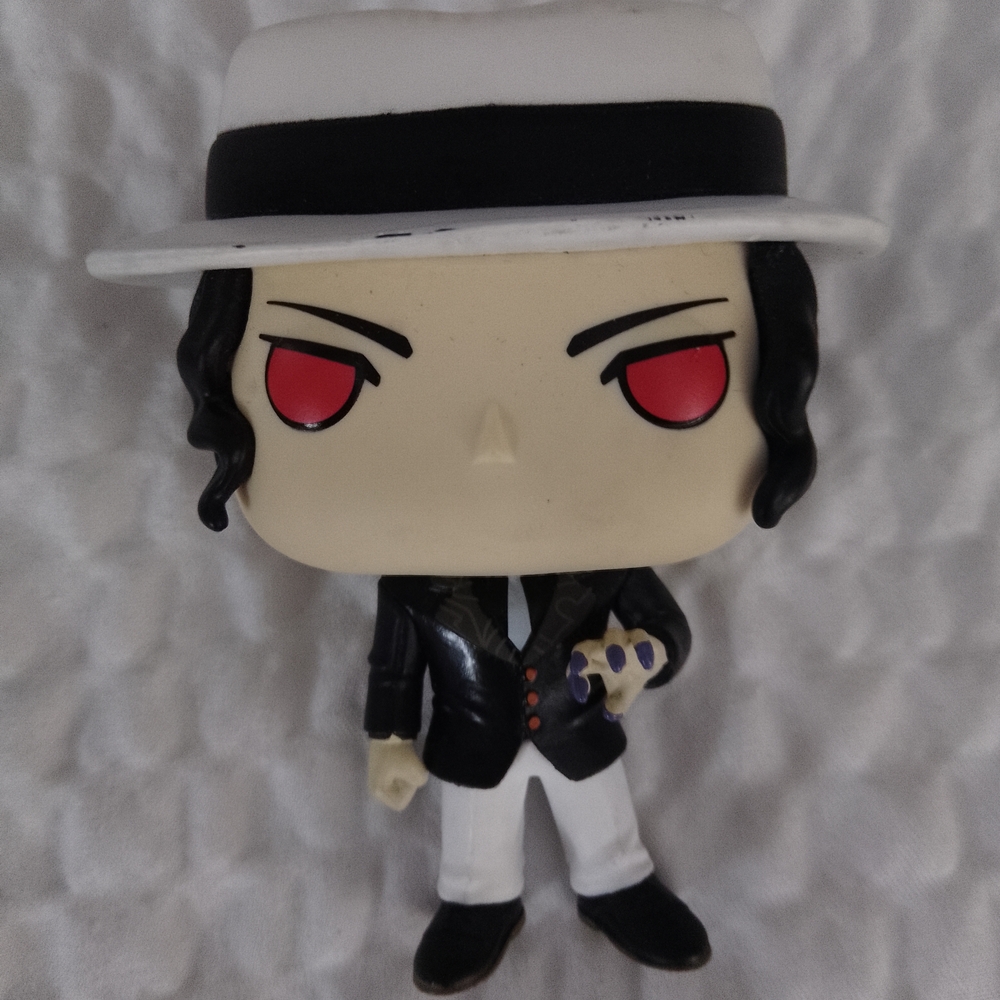 Stylish Black and White Figurine with Red Eyes
